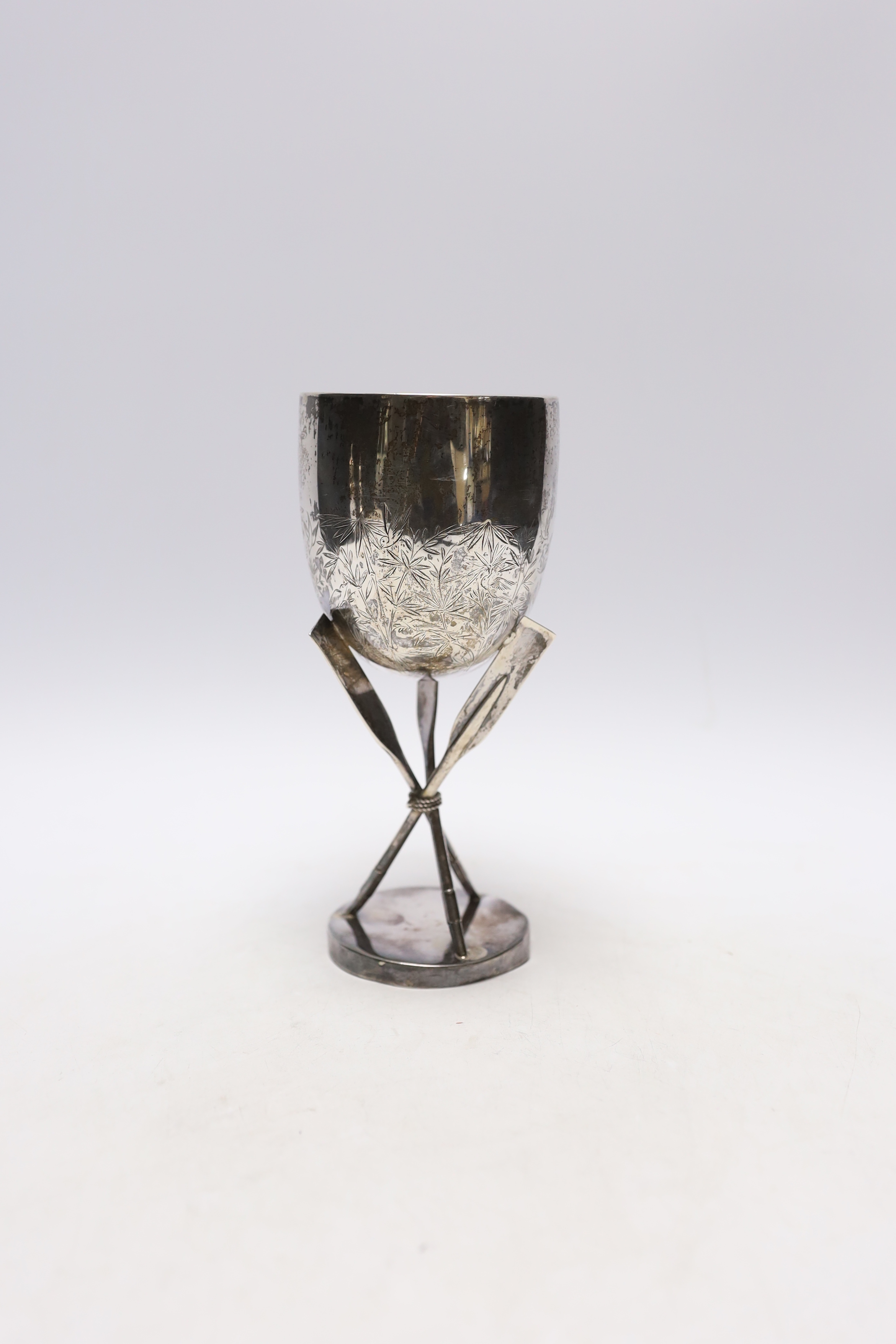 A late 19th century Chinese sterling presentation 'Hong Kong Regatta' rowing trophy goblet, with crossed oar supports and engraved inscription dated 1887, 18.4cm, 7.5oz.